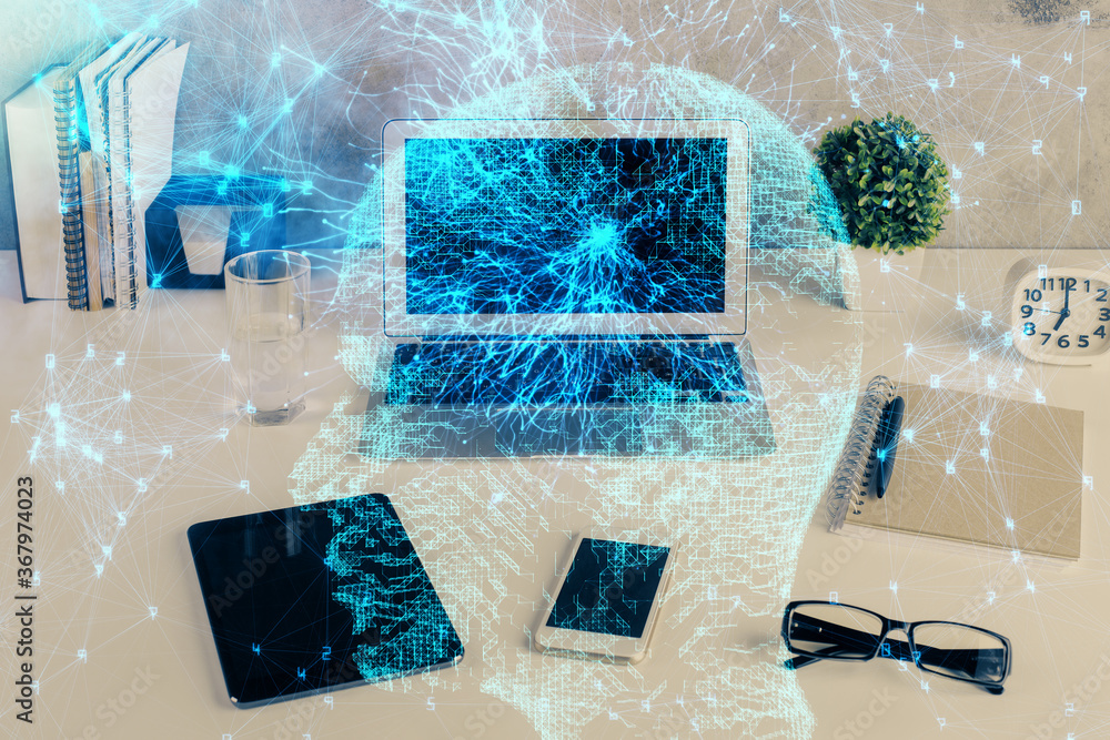 Double exposure of desktop with computer and brain drawing hologram. Artificial intelligence concept. Double exposure of desktop with computer and brain drawing hologram. Artificial intelligence concept.
