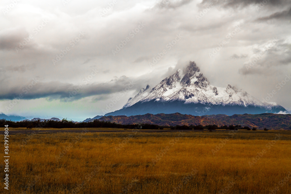 Fototapeta premium Peaked snow-capped mountain peak