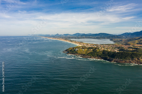 Long beach  lagoon  sea and hill. Picturesque landscape. Ponta Negra Beach  City of Ponta Negra  State of Rio de Janeiro  Brazil. 
