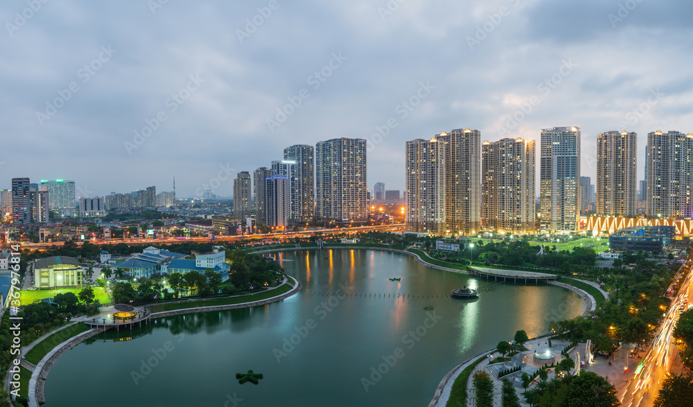 Fototapeta premium Cityscape of Hanoi skyline at Thanh Xuan park during sunset time in Hanoi city, Vietnam