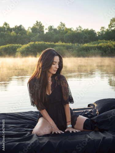 Early morning on the river. Beautiful breakfast for the girl. Floating bed. Surprise and a gift for the girl. Boudoir photography. Romantic picnic.