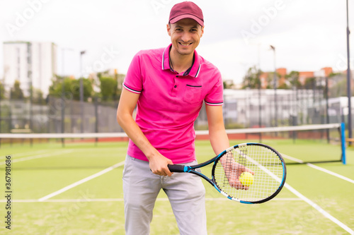Male tennis player on the tennis court © Angelov
