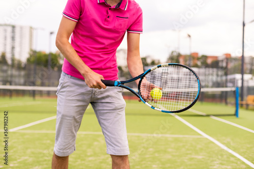 Male tennis player on the tennis court © Angelov