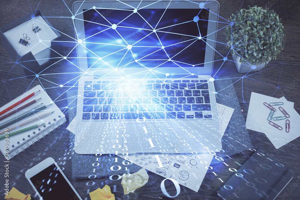 Double exposure of laptop computer and technology theme hologram. Concept of freelance work. Double exposure of laptop computer and technology theme hologram. Concept of freelance work.