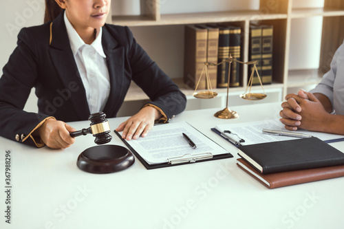 Lawyer is explaining about the wrongdoing laws regarding fraud to the client at the office.
