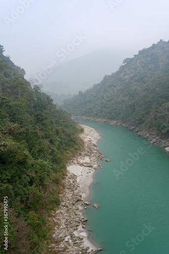 River of green water through mountains. photo
