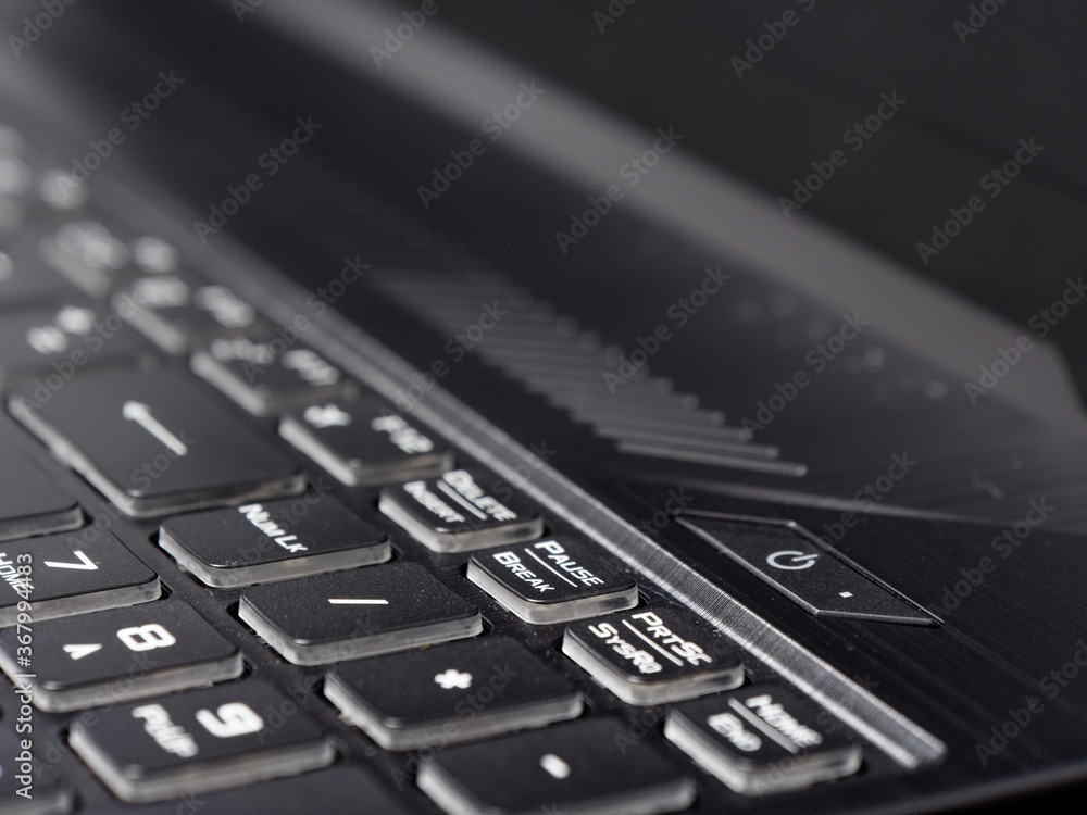 fashionable backlit laptop keyboard on dark background fashionable backlit laptop keyboard on dark background