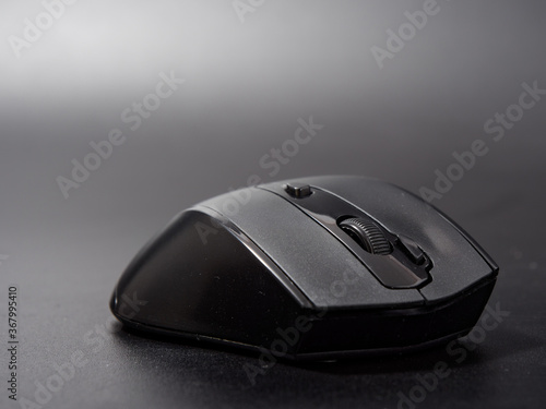 black modern computer mouse on dark background