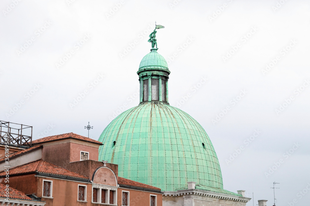 The dome of San Simeon Piccolo church in Venice during a white cloudy day