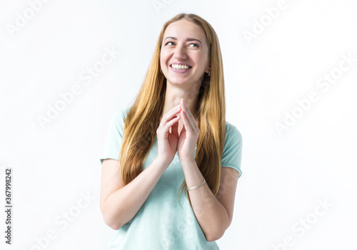 Wallpaper Mural Portrait of a smiling girl, hands in front of her chest. Girl on white background Torontodigital.ca