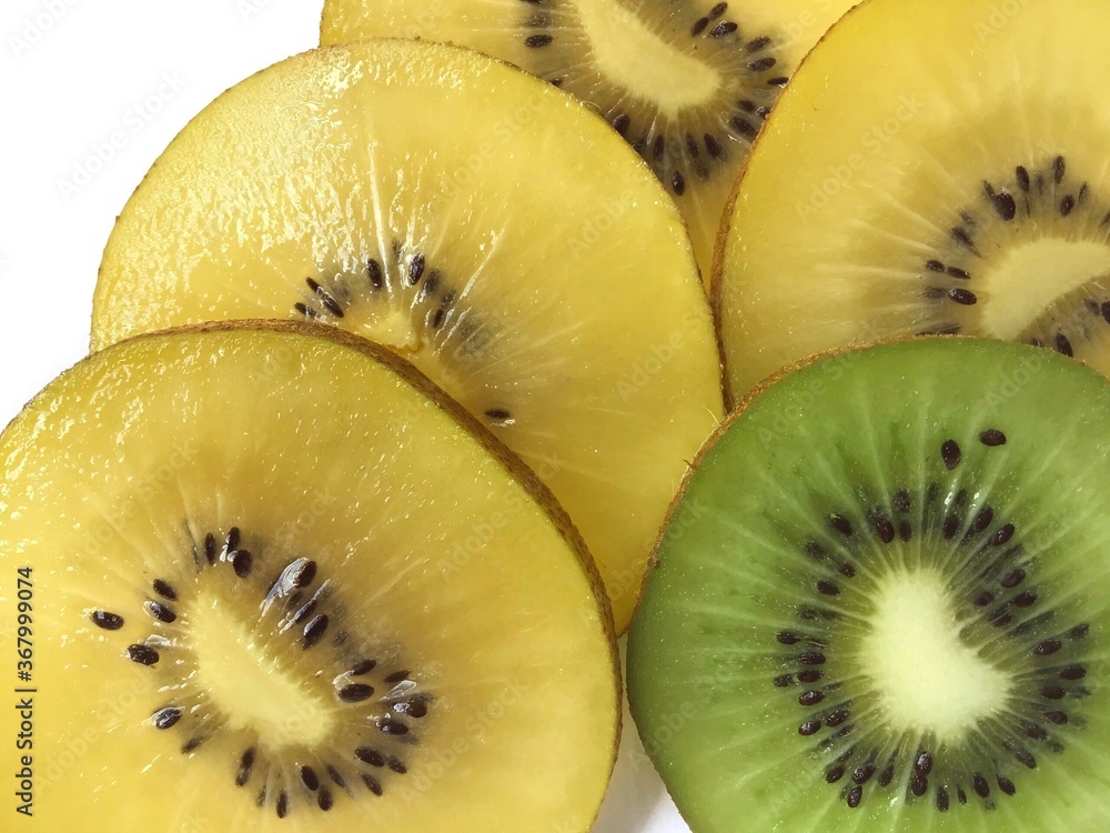 slices of fresh green and yellow kiwi fruits as a food background texture slices of fresh green and yellow kiwi fruits as a food background texture