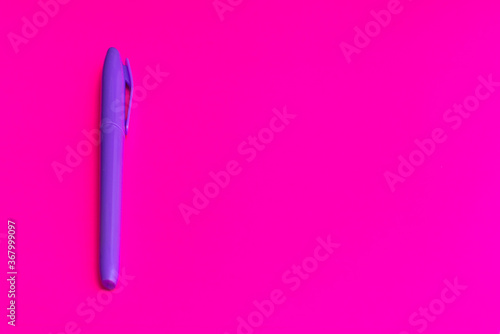 Magenta colored highlighters at magenta background with copy space