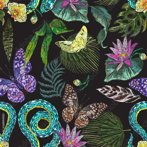 Embroidery with exotic floral pattern with butterflies, snake and tropical flowers. Vector seamless embroidered pattern for fashion design.