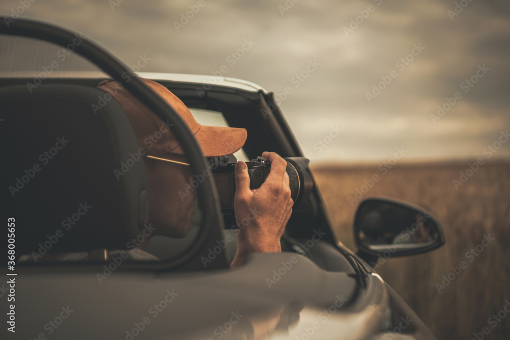 Tourist Taking Pictures From His Convertible Car While on the Road Trip