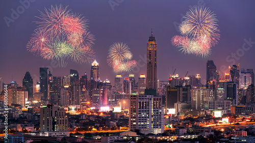Fireworks light up show on sky over Bangkok City downtown at night,Thailand. Bangkok is the most populated city in Southeast Asia.
