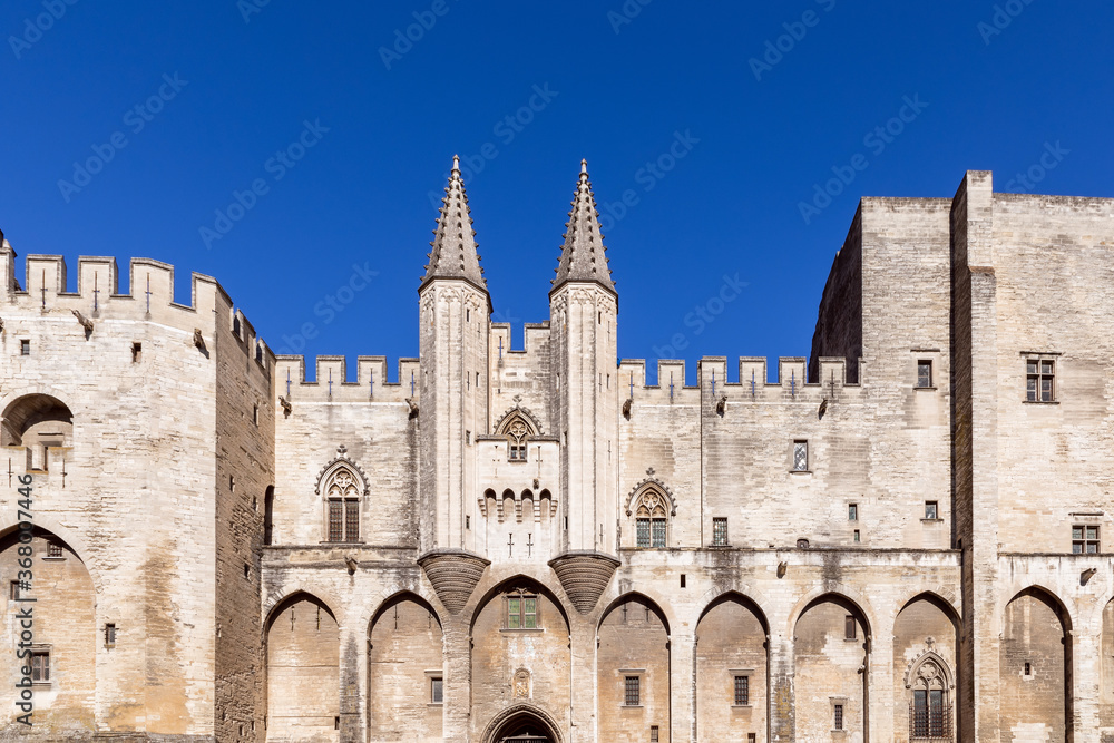 View of the castle facade of Palace of the Popes in the city of Avignon