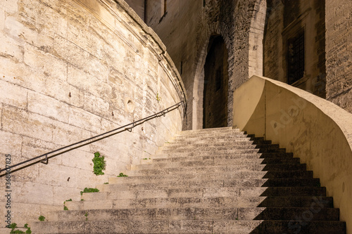 Avignon - France. July 04, 2020: Main staircase of Palace of the Popes in Avignon city (at night)