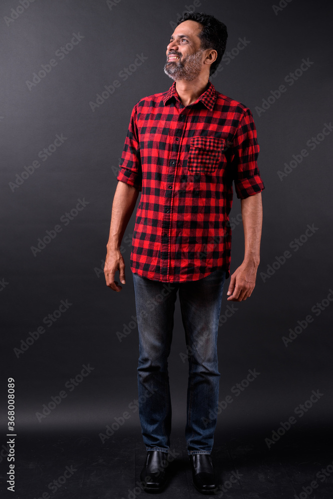 Portrait of mature bearded Indian hipster man Portrait of mature bearded Indian hipster man