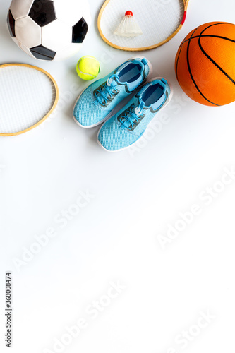 Sport games background - basketball, soccer ball, rockets, sneakers - copy space