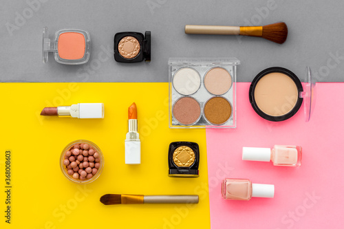 Set of decorative makeup cosmetics on colorful background, top view