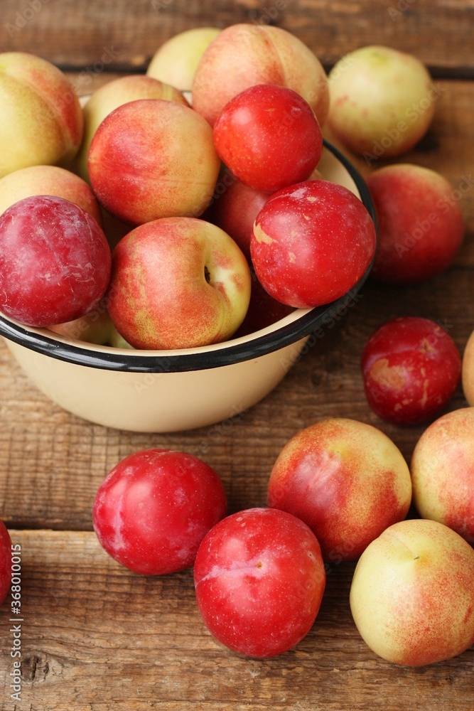 Nectarines and plums on a wooden table macro Nectarines and plums on a wooden table macro