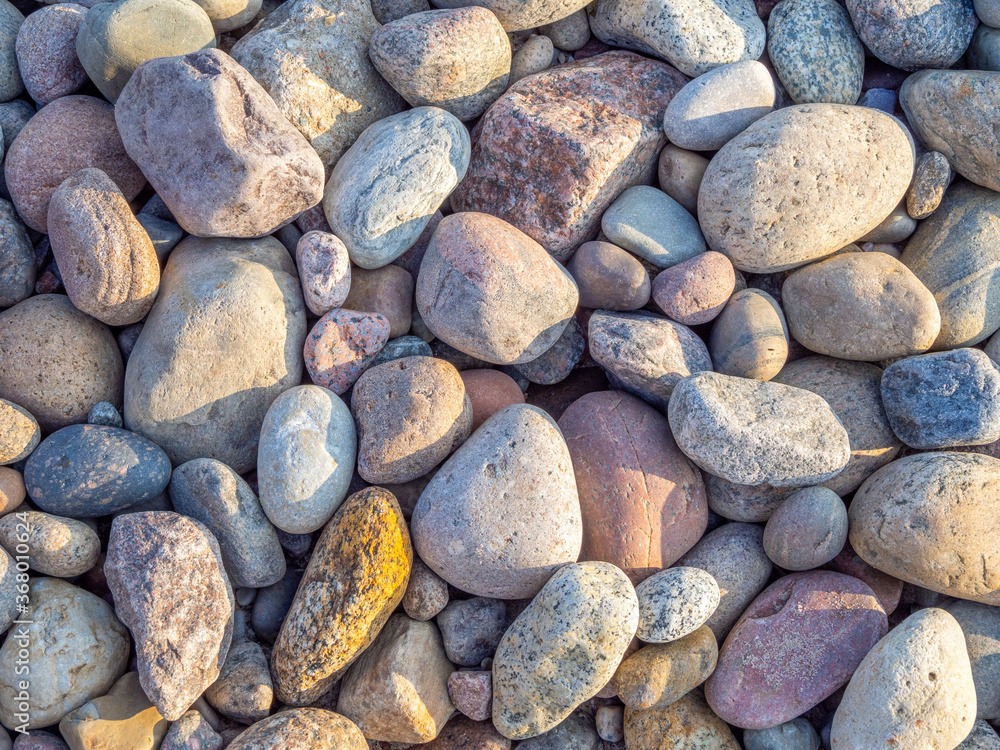 some colourful stones on the beach of the Baltic Sea form a pattern some colourful stones on the beach of the Baltic Sea form a pattern
