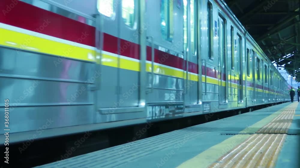 Indonesian Commuter Trains (KRL / Commuter Line) pass Gambir Train Station, Jakarta Indonesian Commuter Trains (KRL / Commuter Line) pass Gambir Train Station, Jakarta