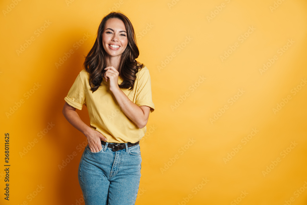 Image of joyful charming woman laughing and looking at camera Image of joyful charming woman laughing and looking at camera