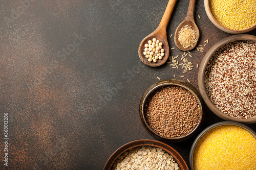 Set with various cereal grains on metallic surface
