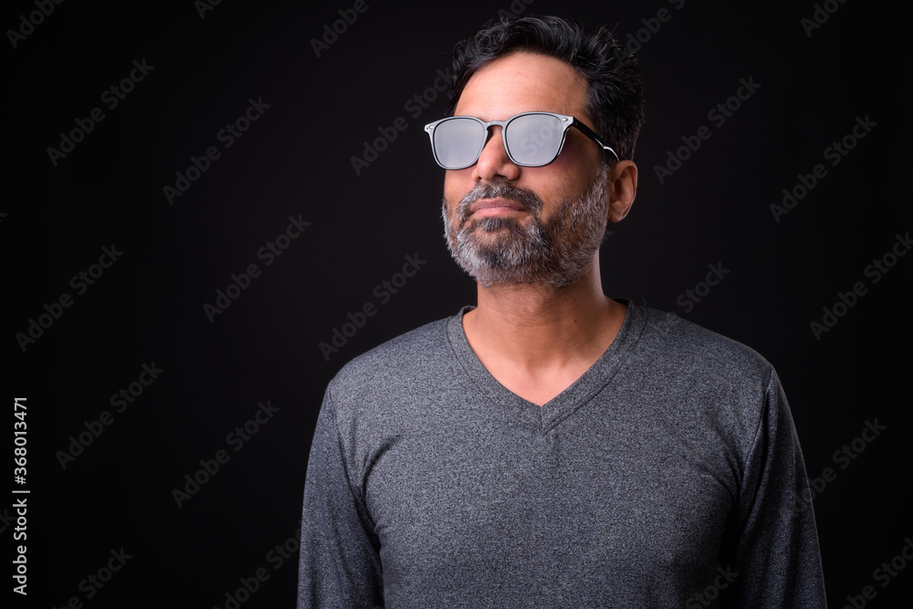 Portrait of mature bearded Indian man with curly hair Portrait of mature bearded Indian man with curly hair