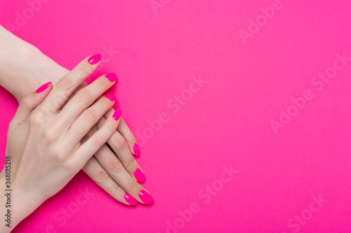 Girl s hands with pink manicure. Bright  rich color