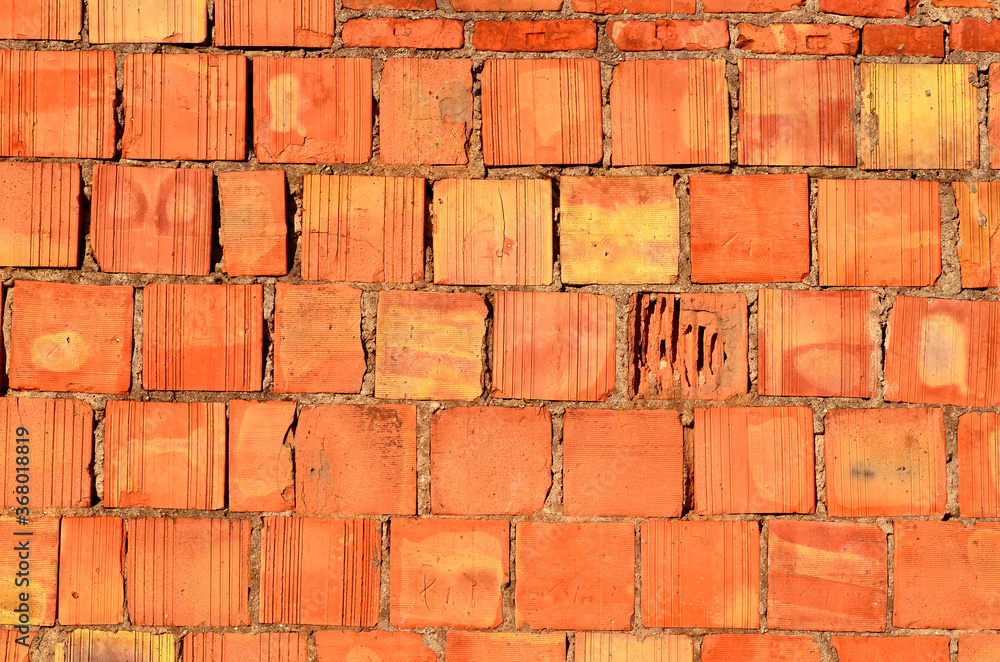 Fototapeta premium texture of square corrugated red brick wall background