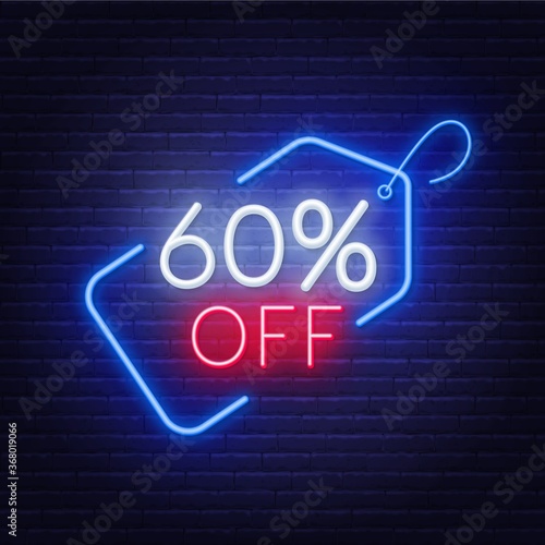 60 percent off neon sign on a dark background .