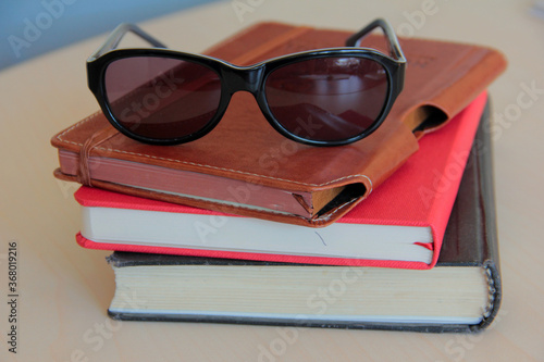 books and glasses on the table