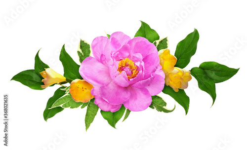 Pink peony and yellow freesia flowers withj green leaves in a floral arrangement