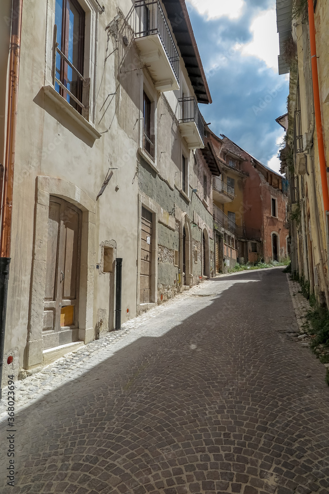 Small streets with houses in the city of Aquila, commune of L´aquila, Abruzzo region, Italy
