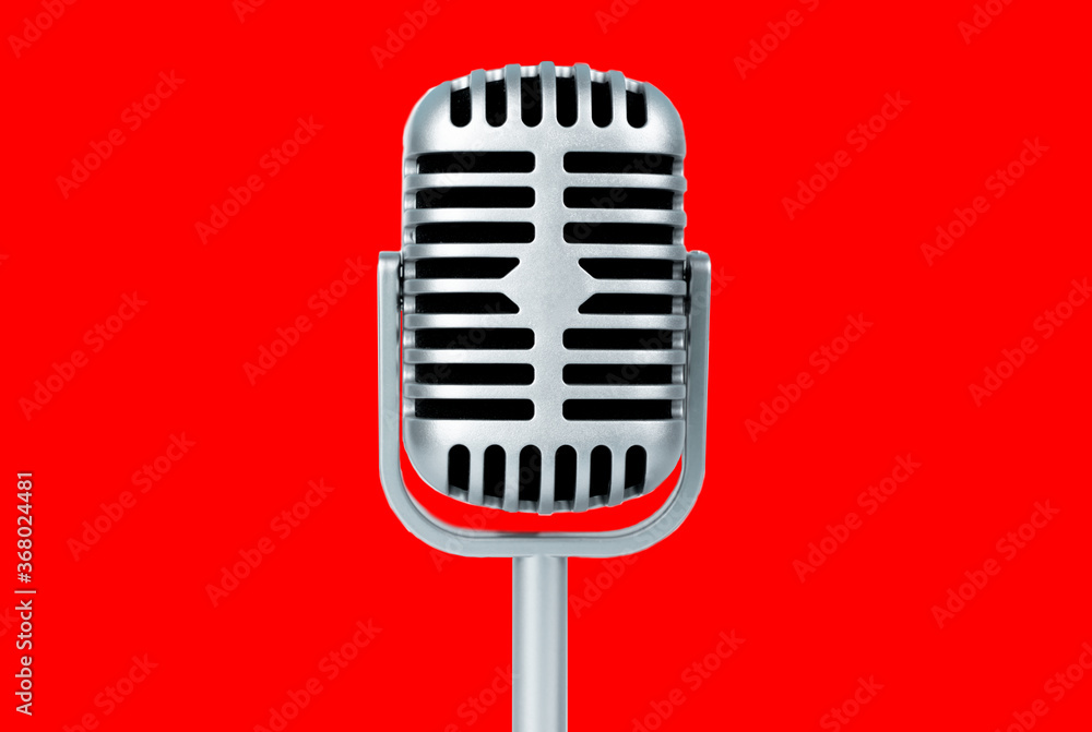 Retro microphone on red background Retro microphone on red background