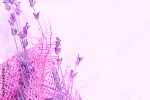 Vintage concept: lavender flowers in jute texture canvas, purple aesthetic photo