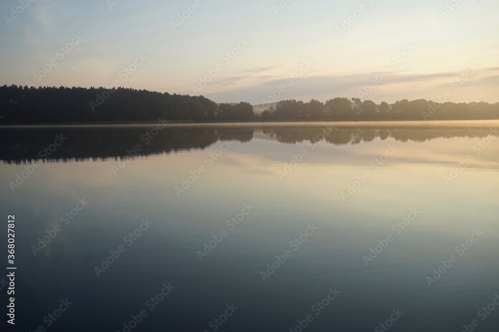 Morning fog at lake Paelitzsee, Mecklenburg lake district.    