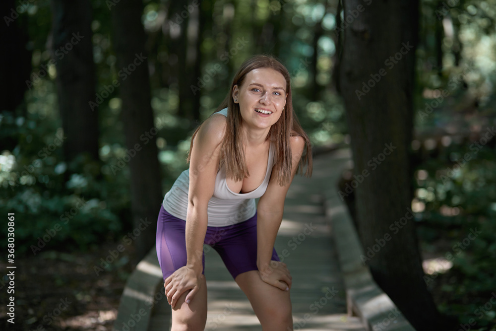 Beautiful young healthy girl goes in for sports in a summer park. Beautiful young healthy girl goes in for sports in a summer park.