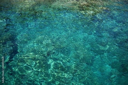 The surface of the clean and transparent Aegean Sea.