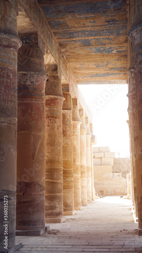 Luxor Egypt Columns in Karnak temple with remaining clue color paint on ceiling