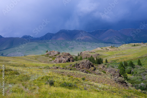 Majestic mountain landscape, cloudy sky before a thunderstorm. © Irina
