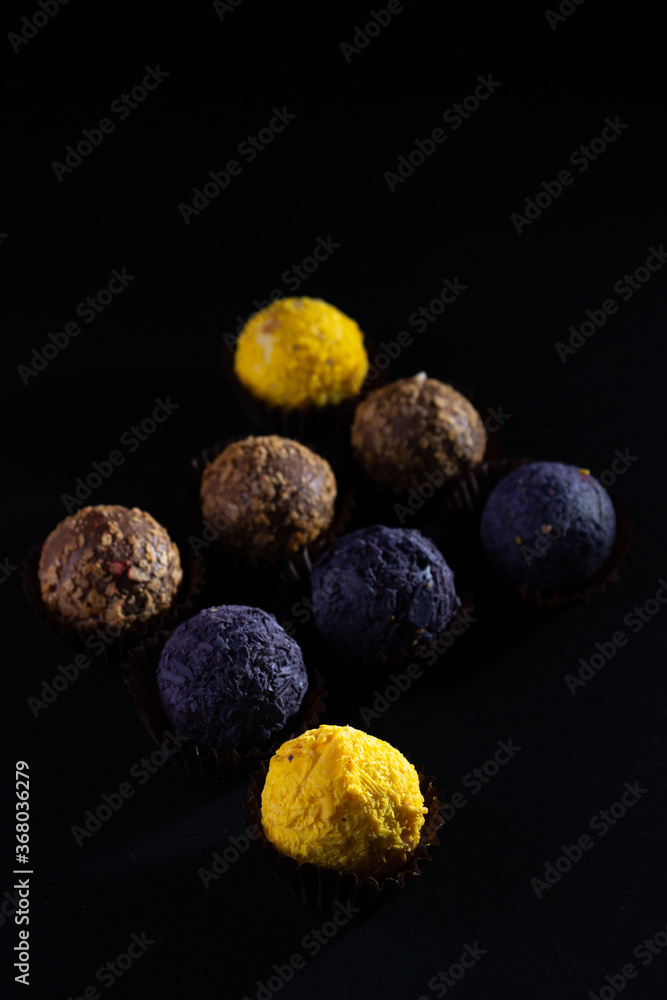 Colored round candies on a dark background Colored round candies on a dark background