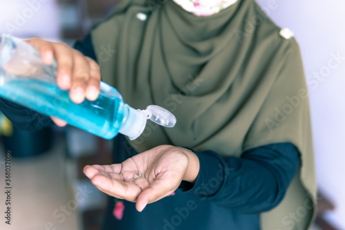 women holding a bottle of gel protection 