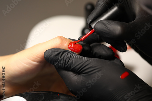 The master provides the client with a full range of manicure services. Gel extension of nails