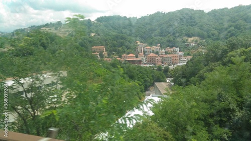 City surrounded by trees in Genoa