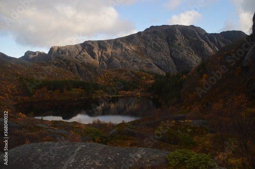 Colorful autumn refelctions and colors in the mountains on the beautiful fjords of Lofoten in Norway