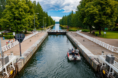 Asikkala, Finland - 16 July 2020: Vaaksy Canal between two big lakes Vesijarvi and Paijanne. Gateway is open for boats going though. © Elena Noeva