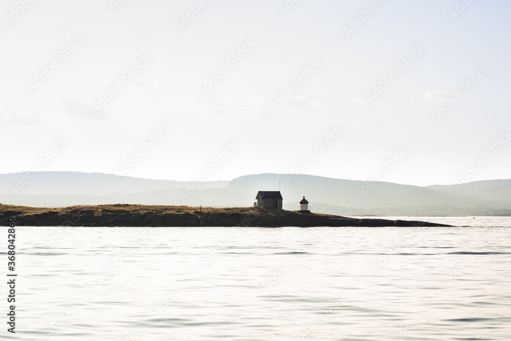 Fototapeta premium Small lighthouse at sunset